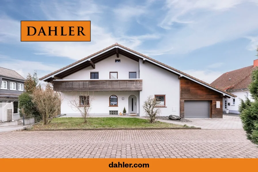  - Haus kaufen in Lollar / Odenhausen - Schönes Mehrfamilien-Chalet in ruhiger Lage