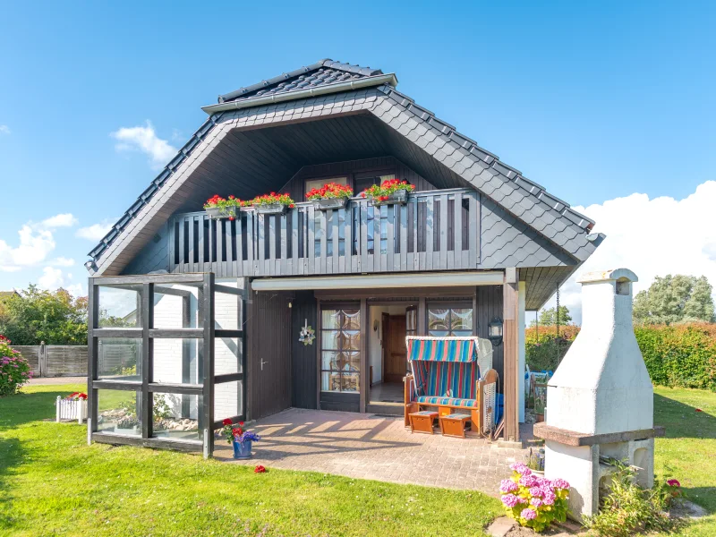 Terrasse mit festem Windschutz