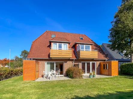 Gartenansicht - Wohnung kaufen in St. Peter-Ording - Ferienwohnung mit Sonnenterrasse im Herzen von St. Peter-Ording