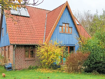 Sonnenseite - Haus kaufen in Stedesand - Naturhaus mit lichtdurchfluteten Räumen in Stedesand