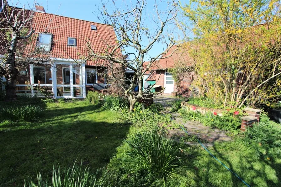 - Haus kaufen in Langeoog - Charmante Doppelhaushälfte mit einladendem Wintergarten