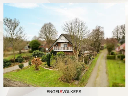  - Haus kaufen in Wiesmoor - Einfamilienhaus mit Einliegerwohnung und Garage – Wohnen nahe dem Golfplatz