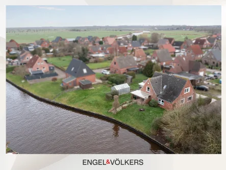  - Haus kaufen in Emden - Einfamilienhaus mit PV-Anlage in direkter Kanallage!