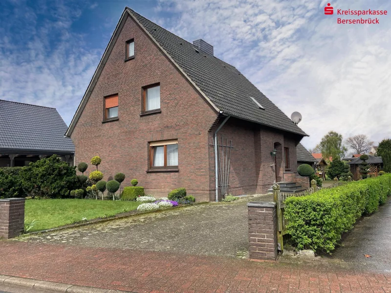 Südansicht - Haus kaufen in Bersenbrück - Einfamilienhaus mit großem Siedlungsgrundstück in Hastrup
