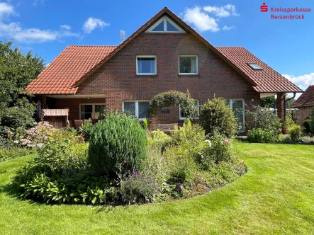 Südansicht - Haus kaufen in Badbergen - Idyllisches Einfamilienhaus mit Einliegerwohnung in Badbergen