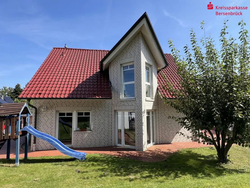 Gartenansicht - Haus kaufen in Bramsche - Einfamilienhaus mit Eigentumsgrundstück auf dem Bramscher Berg