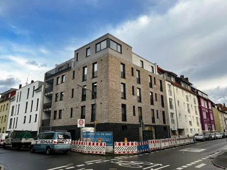 Außenansicht - Wohnung kaufen in Osnabrück - Neubauwohnung mit Blick in den Innenhof in der vorderen Wüste