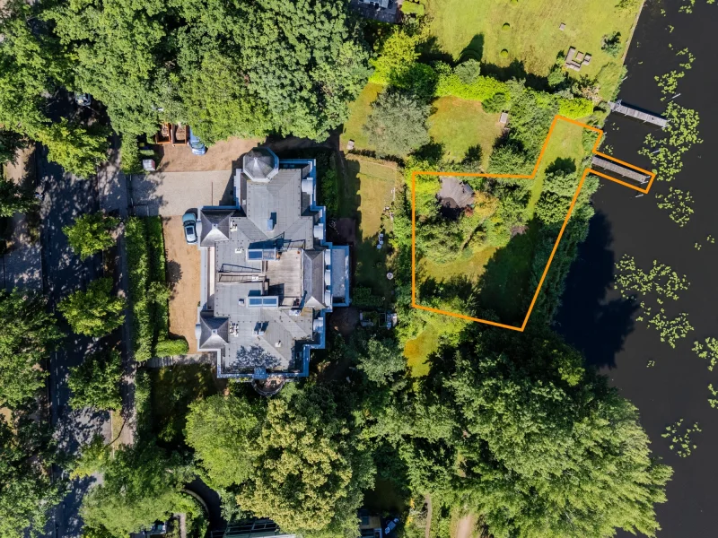 Aerial view of the property with garden, terrace and boat mooring