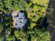 Aerial view of the property with garden, terrace and boat mooring