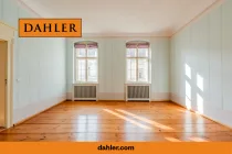 Living room with floorboards and wall paintings