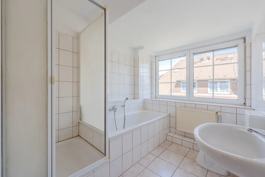 Bathroom with shower and bathtub