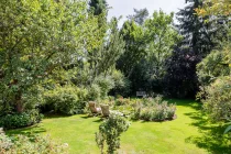 Garden landscape with idyllic natural pond