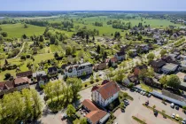 Aerial view of the property with a view of the surrounding fields