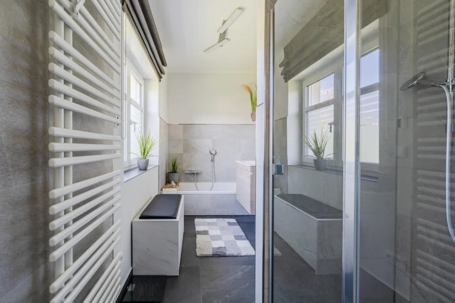 Bathroom with shower and bathtub