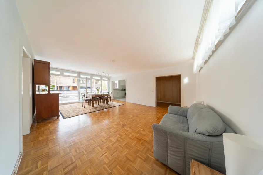 Living area with dining area and adjoining kitchen 