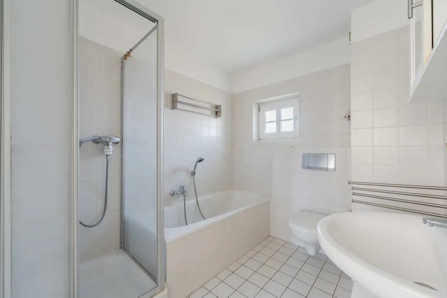 Bathroom with shower and bathtub