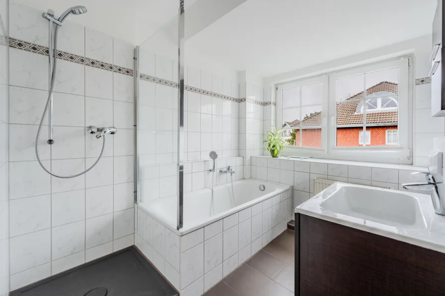 Bathroom with shower and bathtub