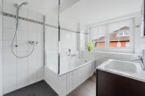 Bathroom with shower and bathtub