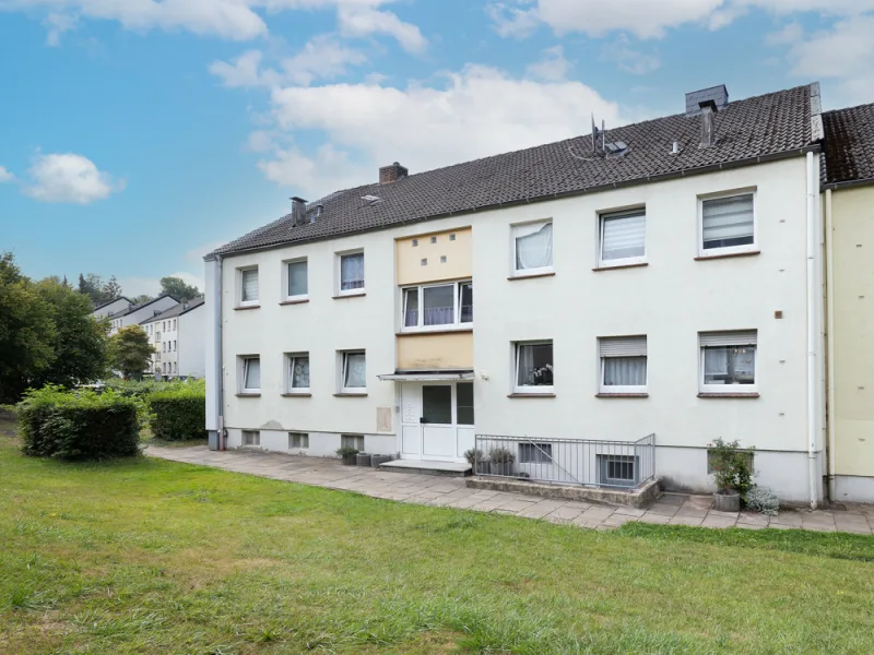 Frontalansicht  - Wohnung kaufen in Georgsmarienhütte - Charmante 3-Zimmer-Wohnung mit Balkon- und Stellplatz!