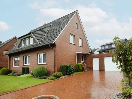 Außenansicht - Haus kaufen in Neuenkirchen-Vörden - Modernisiertes Ein-/ Zweifamilienhaus auf sonnigem Grundstück in familienfreundlicher Siedlung