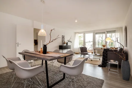 Wohnzimmer - Wohnung kaufen in Unterschleißheim / Lohhof - 2-Zimmer-Wohnung mit großer Süd-Loggia und exklusiver Wellness Oase in ruhiger Lage