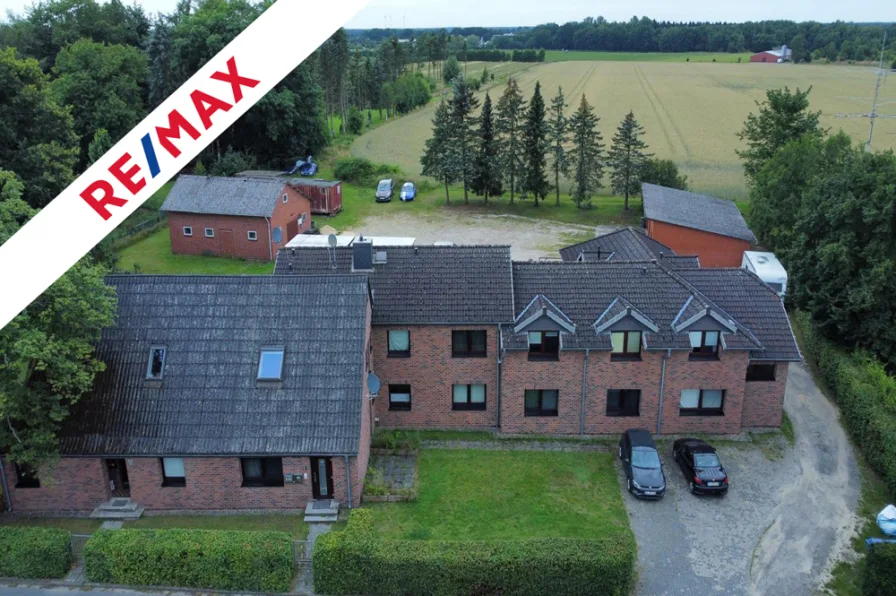 Ansicht - Haus kaufen in Tostedt - Anlageobjekt in Tostedt mit6 Wohnungen + Baufenster für 2 Familienhaus