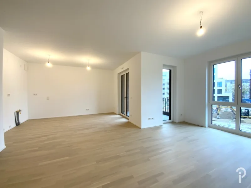 Wohn-/Essbereich - Wohnung mieten in Düsseldorf - Erstbezug - Eine Oase der Ruhe - Großzügige 2 Zimmer-Stadtwohnung mit Einbauküche, Loggia, TG-Platz