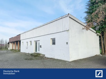 Außenbild - Haus kaufen in Bohmte - Kleiner Bungalow auf großem Grundstück