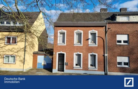 Frontansicht - Haus kaufen in Herzogenrath - Charmante Doppelhaushälfte mit Renovierungspotenzial in sehr guter Wohnlage
