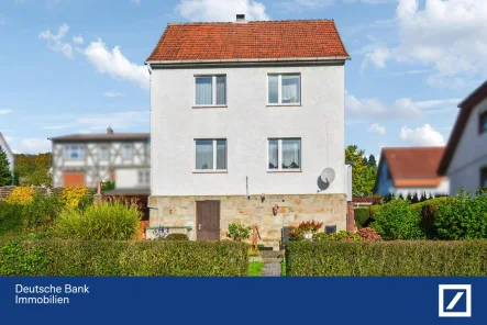 Rückseite - Haus kaufen in Fuldatal - Familienidyll in Fuldatal-Wahnhausen: Charmantes Einfamilienhaus mit 108 m² und eigenem Garten!