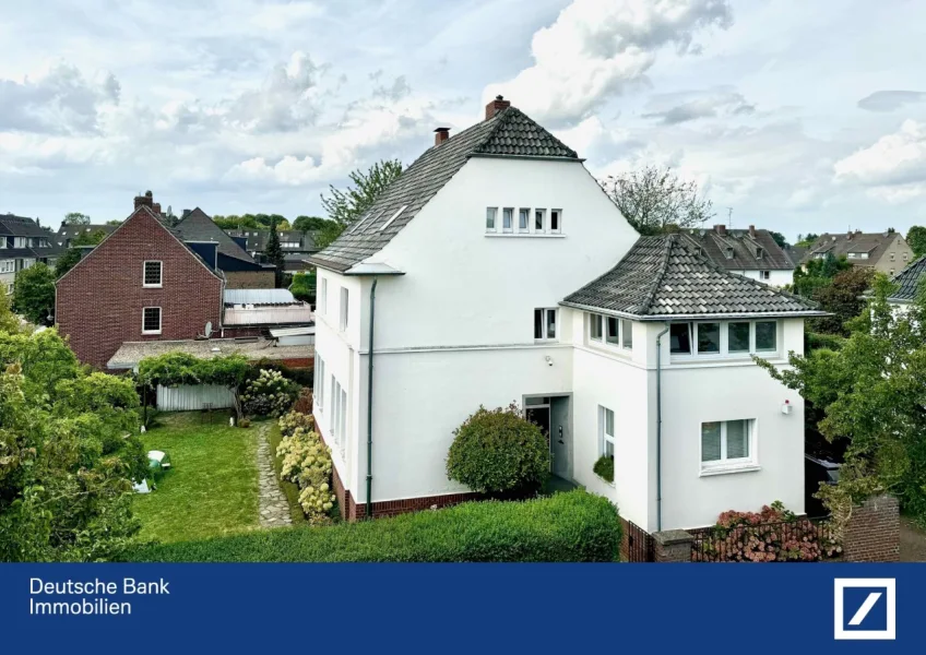 Außenansicht - Haus kaufen in Willich - Wohntraum par excellence: Charmante Villa mit kunstvollen Akzenten in Willicher-Toplage