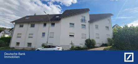 Frontansicht - Wohnung kaufen in Döttesfeld - Charmante Eigentumswohnung mit Garage und Außenstellplatz im idyllischen Westerwald!