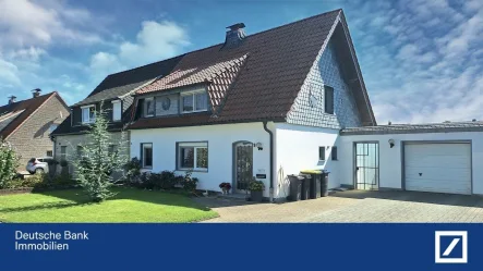 Haus von vorne - Haus kaufen in Rheinberg - Angebot des Monats!!! Gepflegte Doppelhaushälfte mit Wintergarten in ruhiger Wohnlage von Rheinberg!