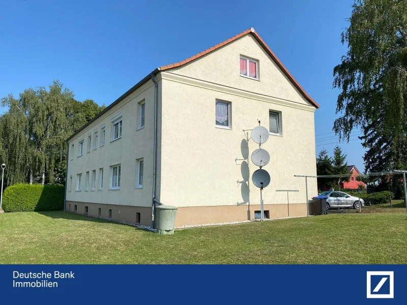 Mehrfamilienhaus, Giebel - Wohnung kaufen in Cölpin - Mit eigenem kleinen Garten vor der Haustür!