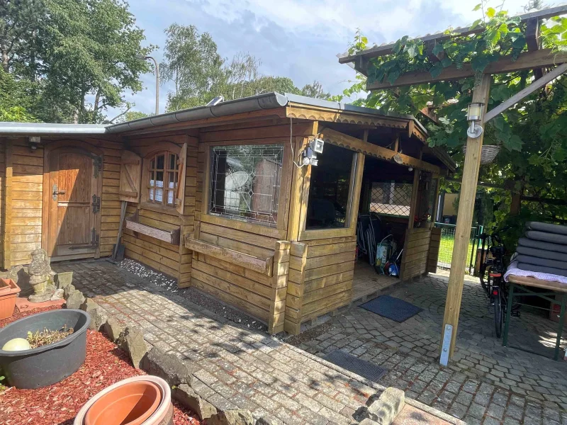 Blockhütte Sitzplatz Pergola