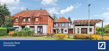 Ansicht - Haus kaufen in Wietzen - Geräumiges Mehrfamilienhaus in zentraler Lage auf weitläufigem Grundstück!