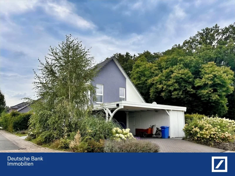 Straßenansicht - Haus kaufen in Lotte - Junger Wohn(t)raum mit Blick ins Grüne!