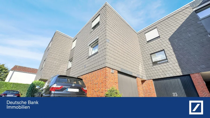 Front - Haus kaufen in Gütersloh - Schönes und gepflegtes Reihenmittelhaus mit ca. 47 m2 Ausbaureserve, Garage und Stellplatz!