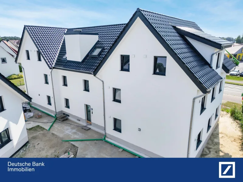 Rückansicht - Wohnung kaufen in Schloß Holte-Stukenbrock - Hochwertige Neubau 3 ZKB-Eigentumswohnung im Erdgeschoss! KFW 40