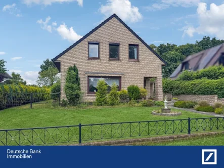 Vorderansicht - Haus kaufen in Ritterhude - Freistehendes EFH mit großzügigem Garten und tollen Blick ins Grüne in TOP Lage