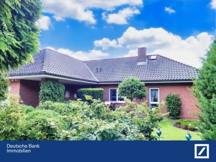 Titelbild - Haus kaufen in Bad Bodenteich - Mehr als nur wohnen - Bungalow mit gehobener Ausstattung und traumhaftem Garten