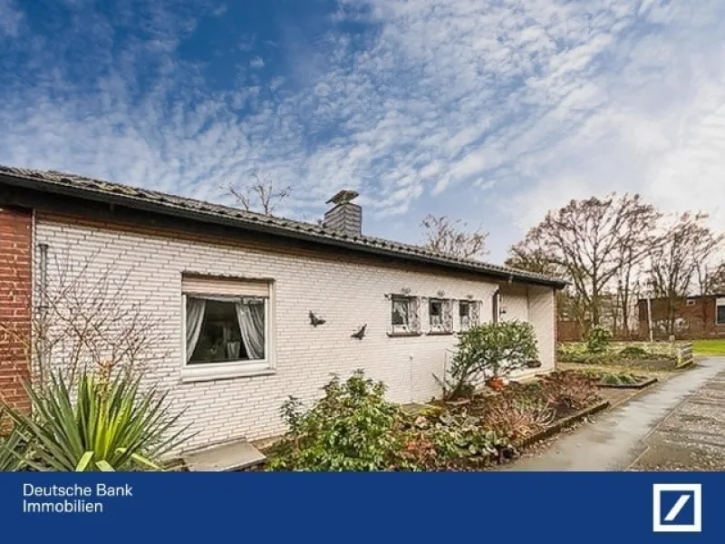 Titelbild Ansicht - Haus kaufen in Moers - Bungalow mit Gartenidylle – Wohnen nach Ihren Wünschen