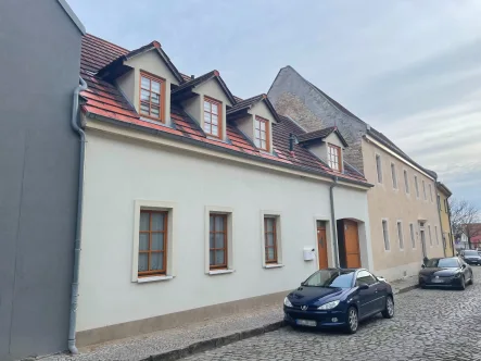 Vorderansicht - Wohnung kaufen in Bernburg - Vermietete Eigentumswohnung in Bernburg