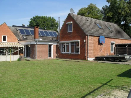 Gartenansicht - Haus kaufen in Langwedel - Umfangreich umgebaute und sanierte Immobilie mit großem Grundstück!