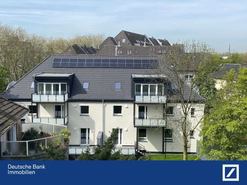 Rückansicht - Wohnung kaufen in Duisburg - Terrassenwohnung mit Garten, Solar + Wärmepumpe - energetisch sanierte ETW auf Neubaustatus