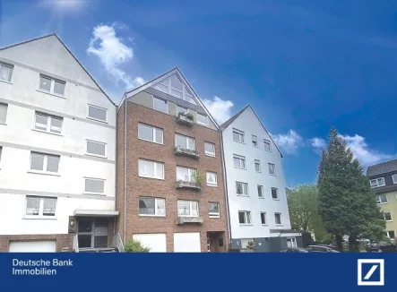 Straßenansicht - Wohnung kaufen in Essen - Charmante, gepflegte 3 Zimmerwohnung mit großem Balkon und Garage in sehr ruhiger Lage (Spielstraße)