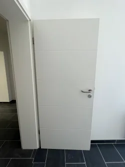 Detail Zimmertür - Wohnung kaufen in Duisburg - Erstbezug nach Kernsanierung ++ Charmant geschnittene Erdgeschoss-Wohnung ++ 32m² große Süd-Terrasse