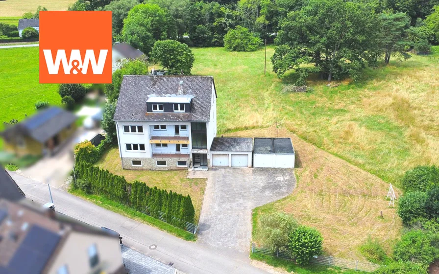 Titelbild - Haus kaufen in Trier / Quint - Top renoviertes Mehrfamilienhaus mit 4 Parteien und 4 Garagen in Trier-Quint!