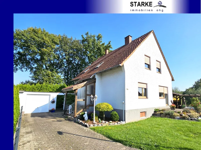 Titelbild - Haus kaufen in Löhne / Gohfeld - Einfamilienhaus mit Garage & Garten in Löhne-Gohfeld