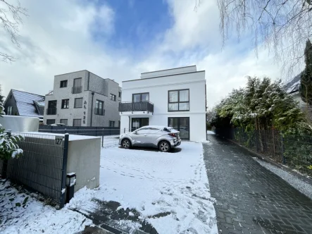 Titelfoto - Wohnung kaufen in Hamburg / Hummelsbüttel - vermietete 2-Zimmer-Erdgeschosswohnung mit Garten und exklusiver Ausstattung